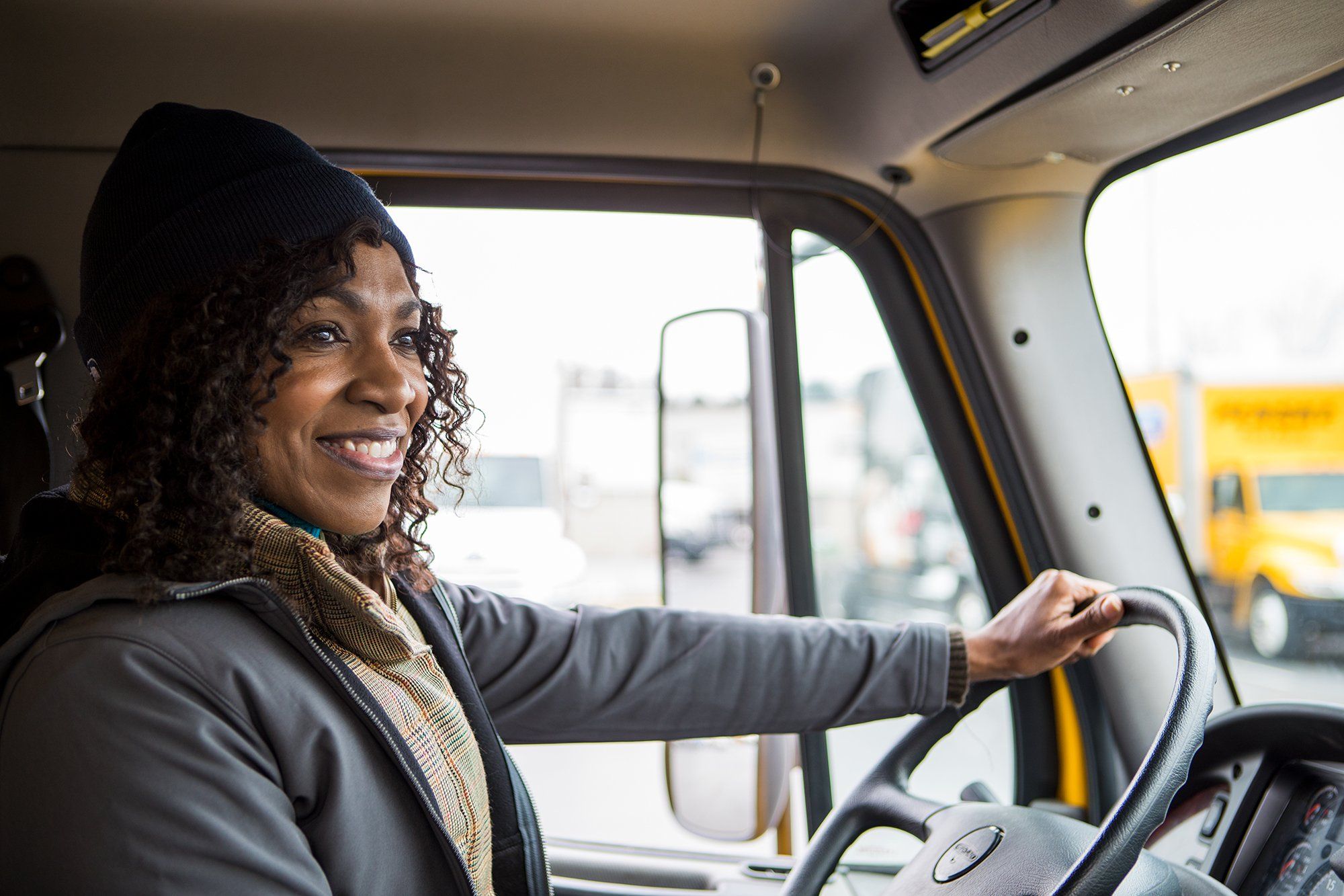 A happy truck driver behind the wheel