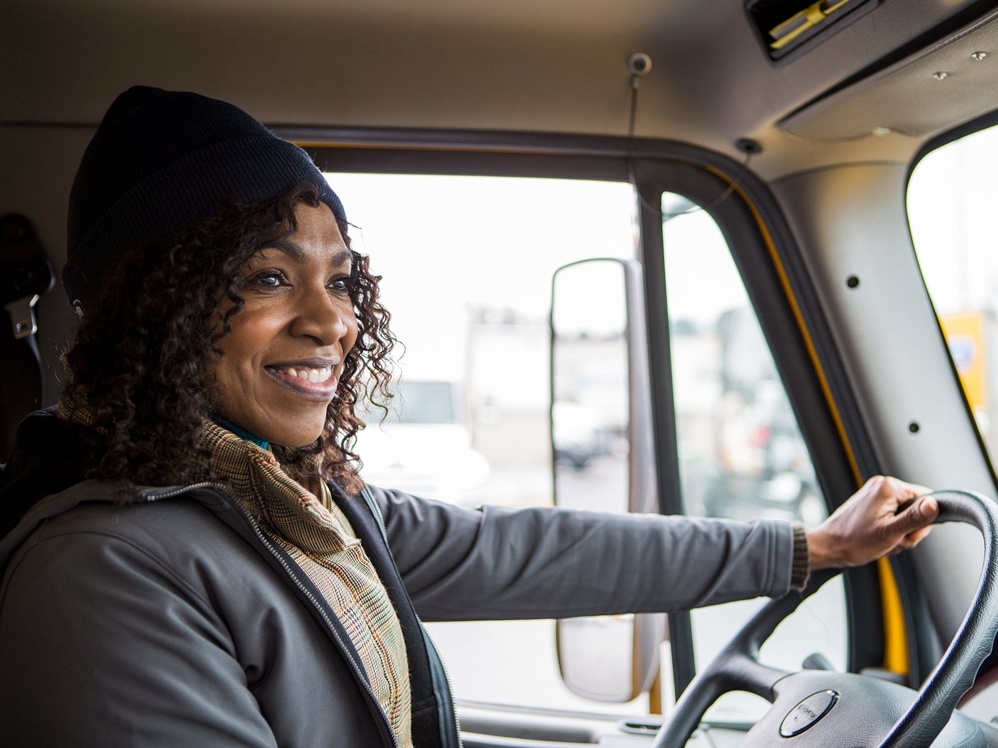 A happy truck driver behind the wheel