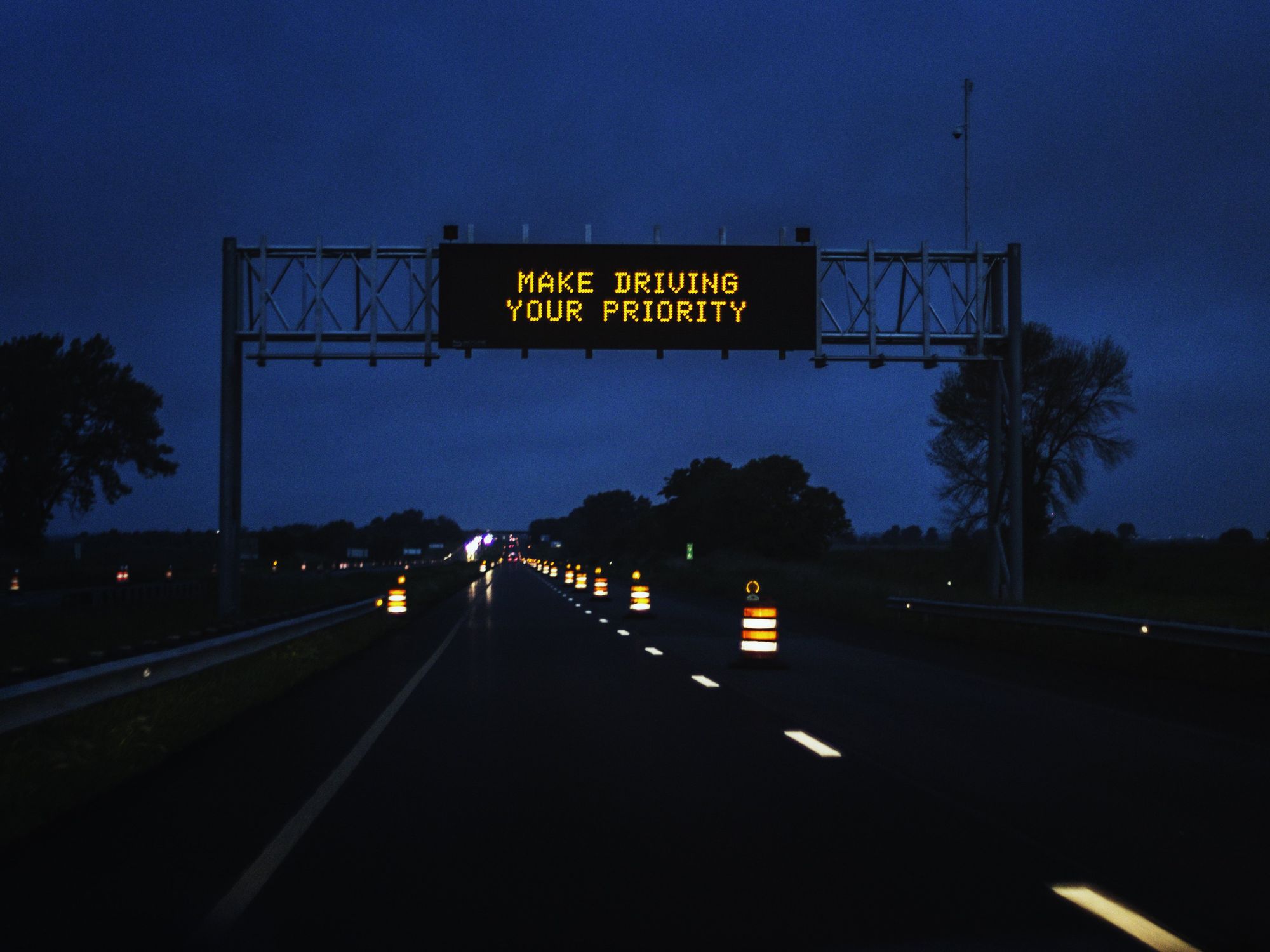 A Make Driving a Priority highway sign