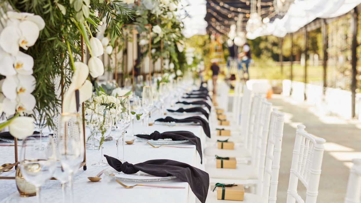 A table set in white for an event.