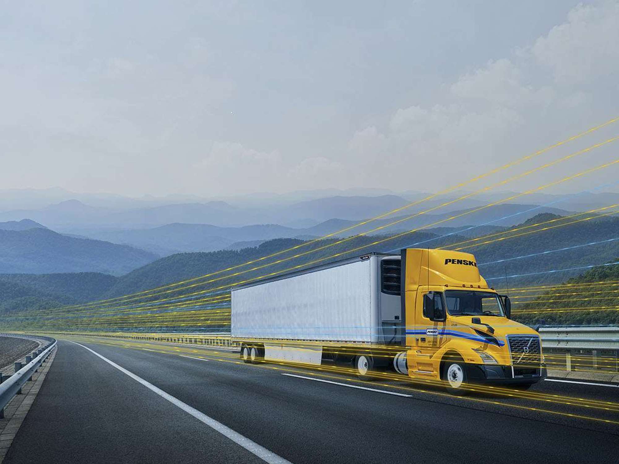 A yellow and white Penske semi-truck driving on a highway with a yellow digital overlay.