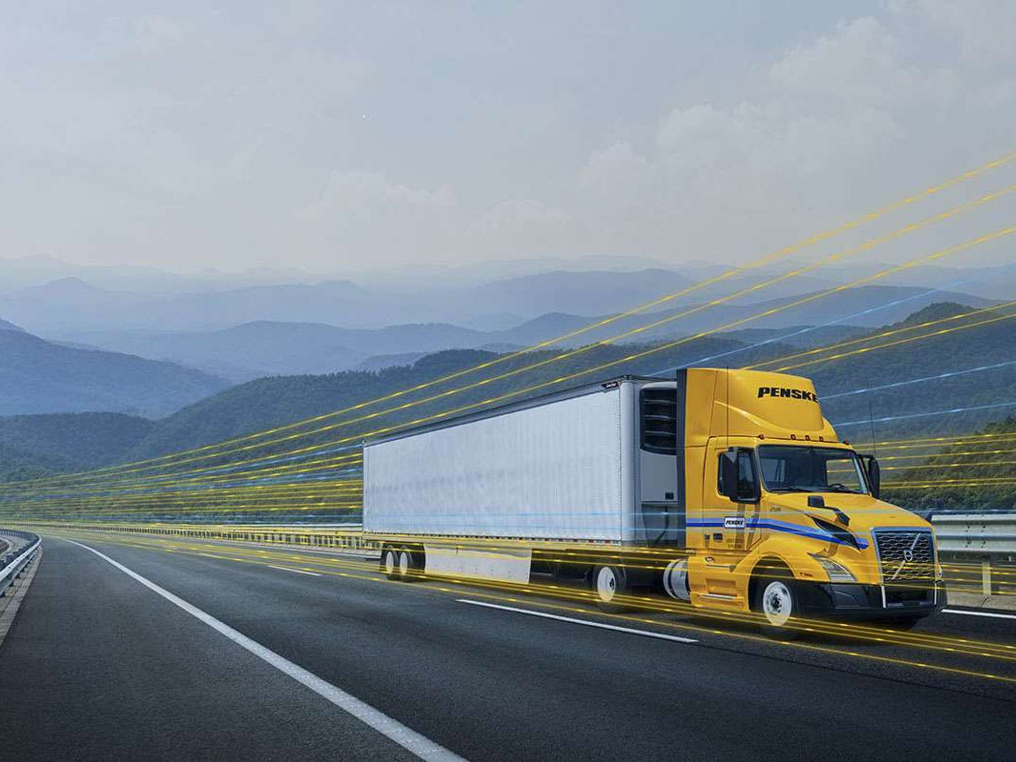 A yellow and white Penske semi-truck driving on a highway with a yellow digital overlay.