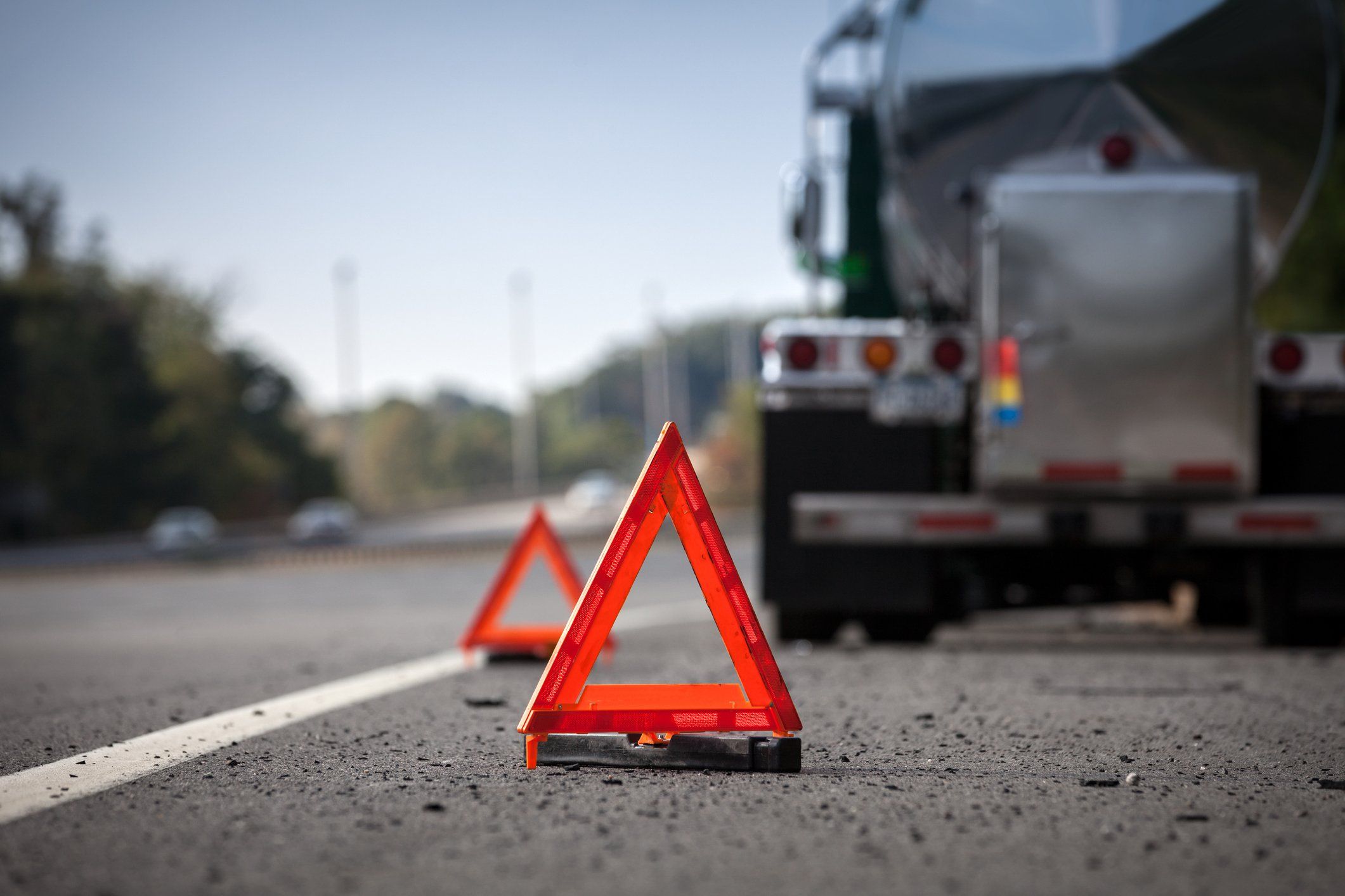 Caution triangles on the road warning of a stopped truck