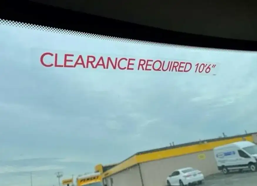 Clearance Required 10'6" sticker on the inside of a Penske truck windshield.