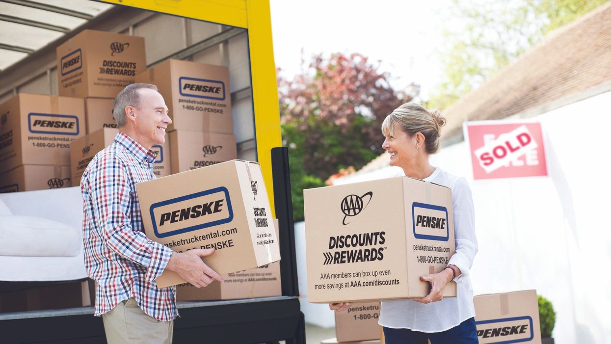 Couple unloading Penske truck