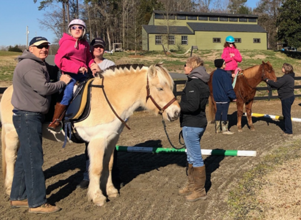 Krisak and daughter with horse