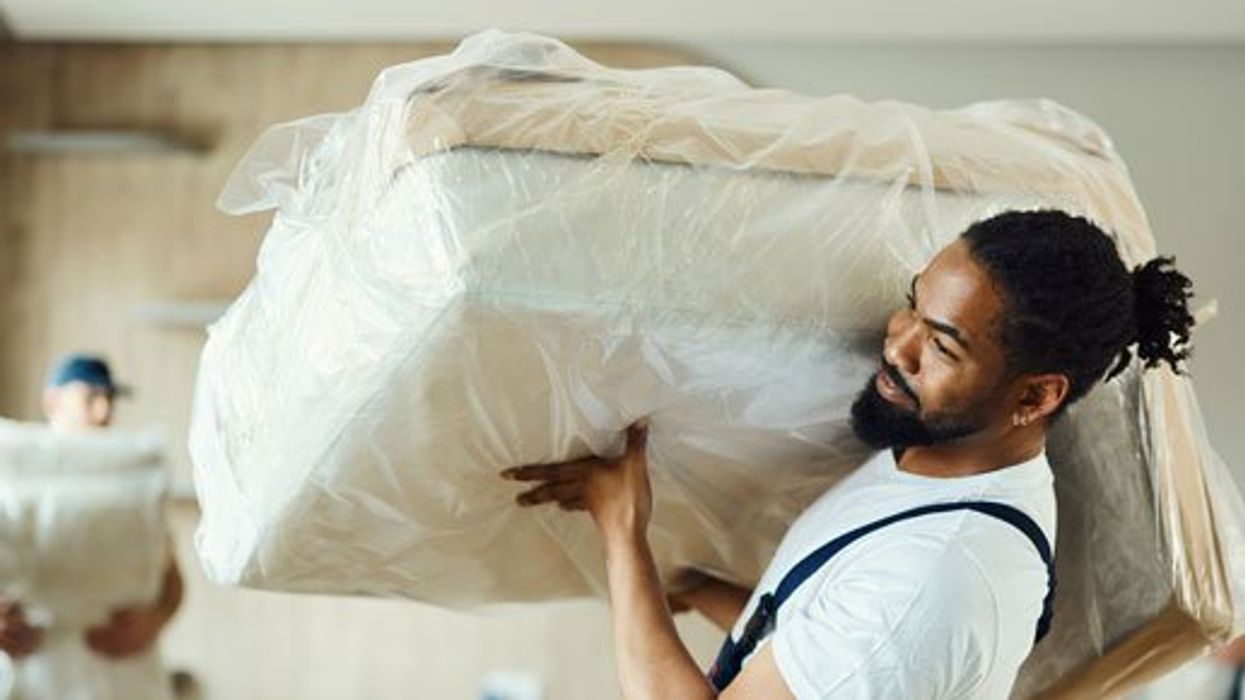 Movers carrying furniture