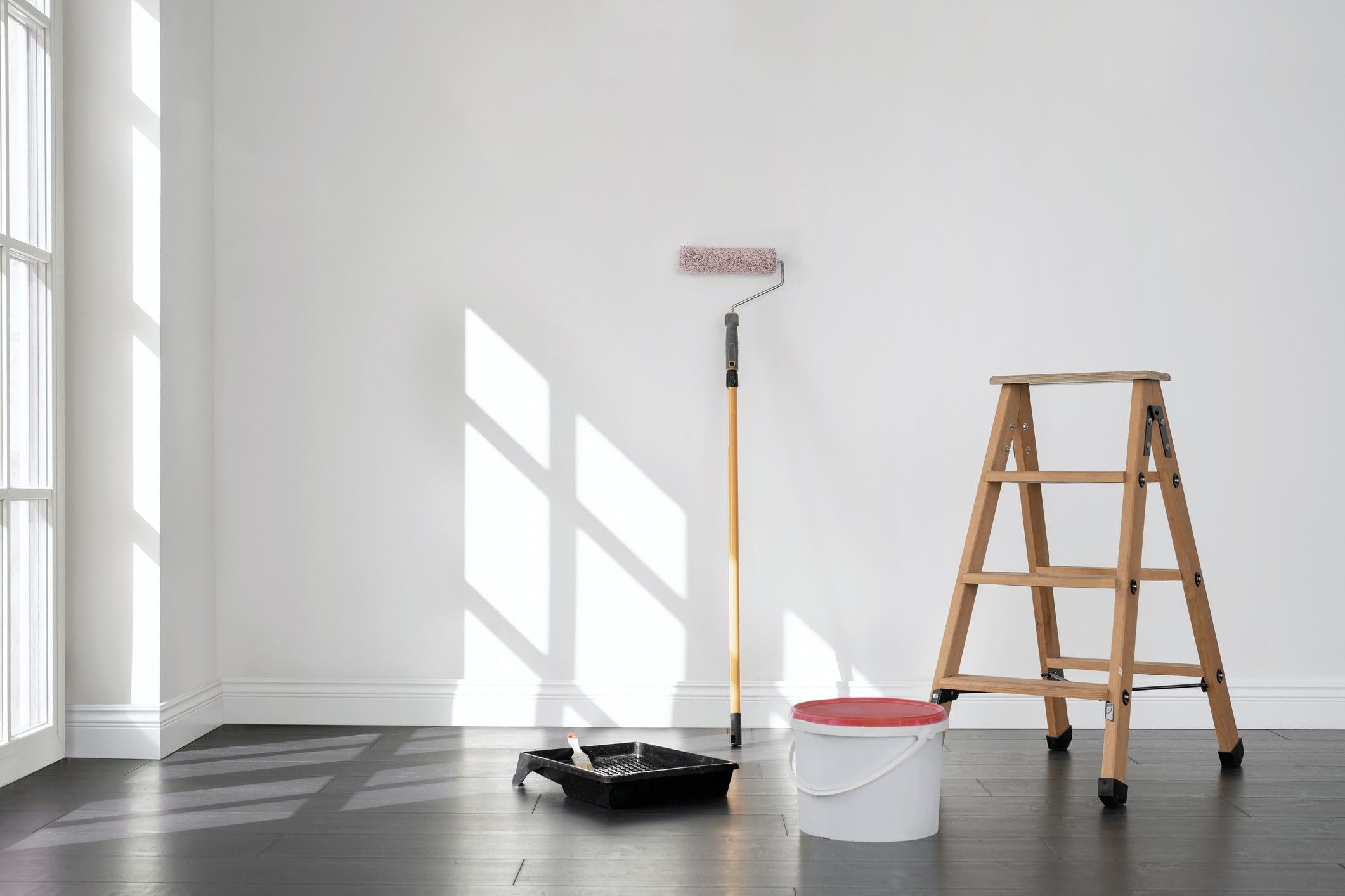 Painting supplies in a cleared out room.