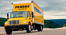 Penske truck driving on road