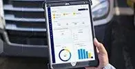 Person holding tablet with data management tool