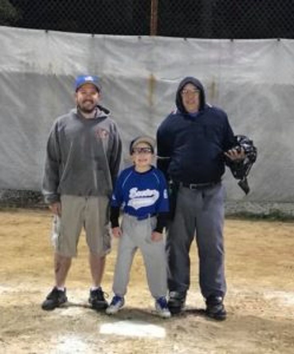 Robinson, on the right with his son on the left and grandson in center.