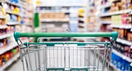 Shopping cart in store aisle