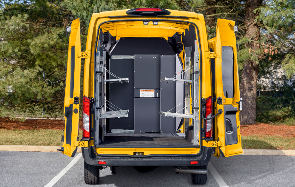 The inside of a Penske delivery van with shelves
